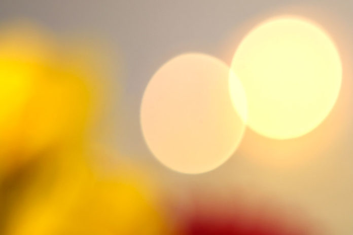 How do optical aberrations manifest in bokeh?