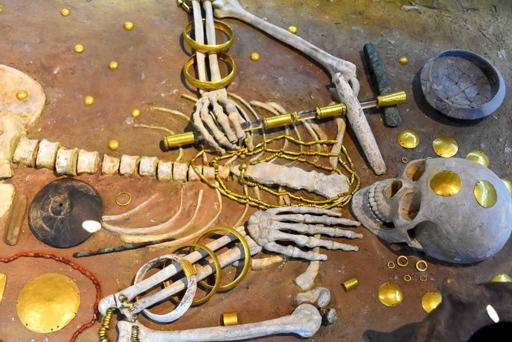 The "Gold Man" from Grave 43, with the richest collection of gold artifacts, symbolizing power and status.