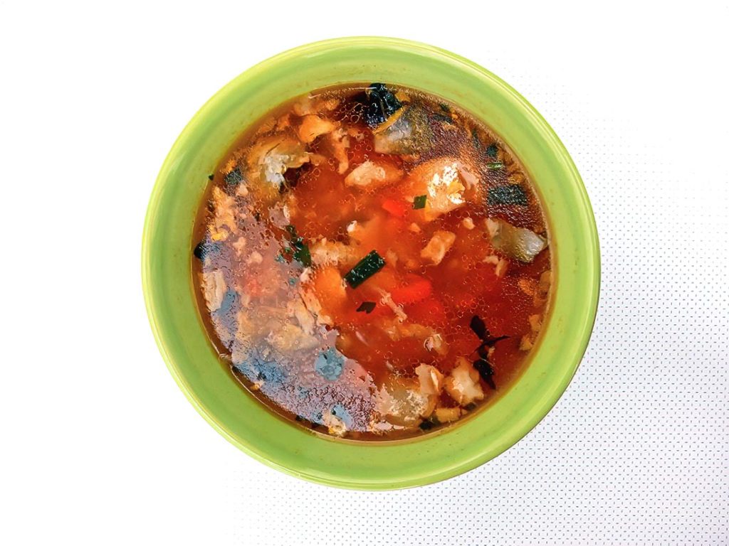 A hearty and flavorful goulash with tender fish and paprika, embodying Hungary's rich culinary heritage.