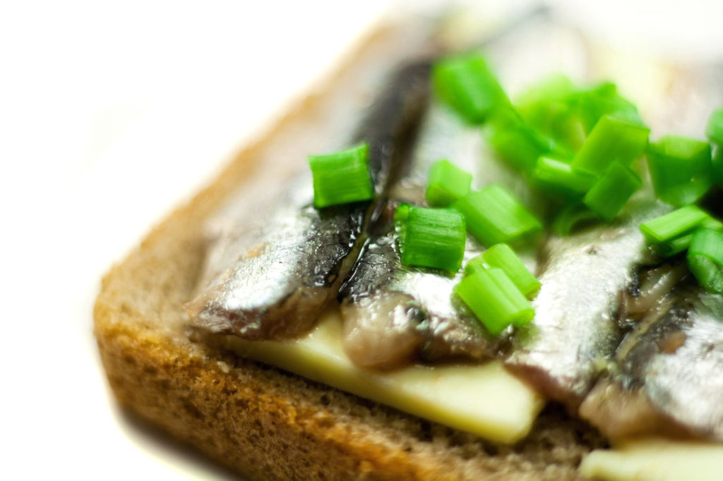 Anchovy Sandwich with Butter and Spring Onion on Dark Bread